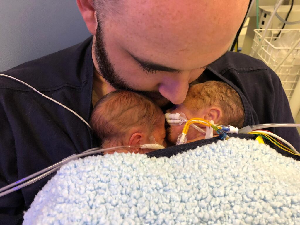 Carl MacDonald kangaroo care with twin sons in NICU