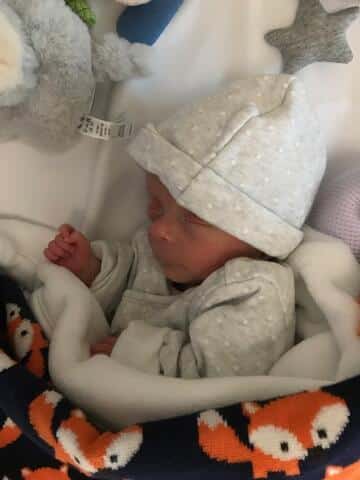 Baby Theo in clothes that were too big